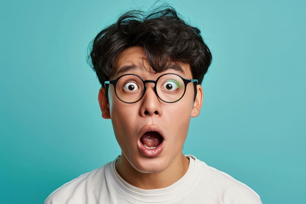 Chinese man surprised face portrait glasses adult.