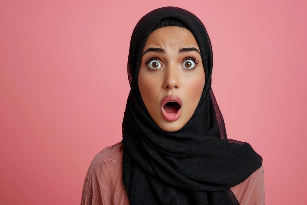 Arab woman surprised face portrait gesturing headscarf.