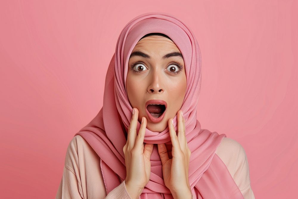 Arab woman surprised face portrait headscarf headshot.
