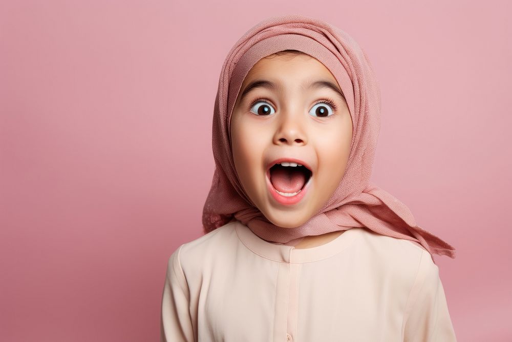 Arab kids surprised face portrait happiness headscarf.