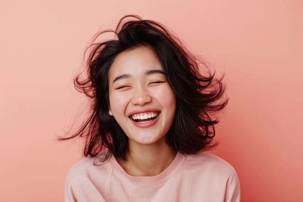 Asian woman happy face laughing portrait smile.