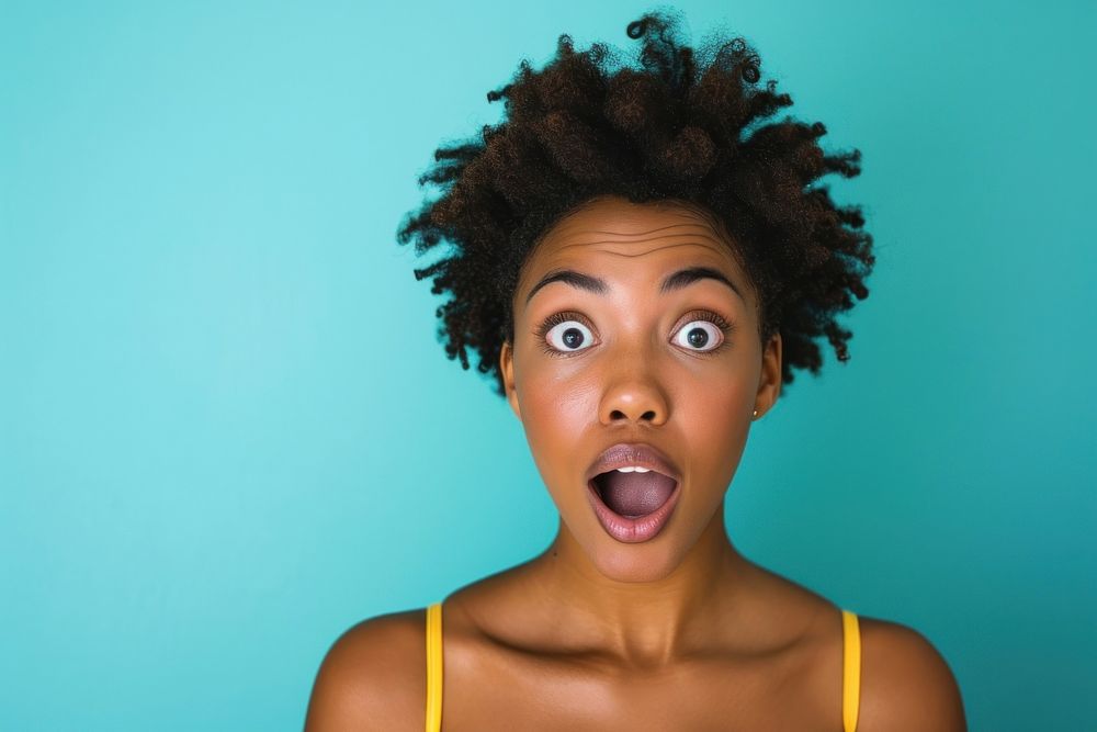 Black woman surprised face portrait adult happiness.