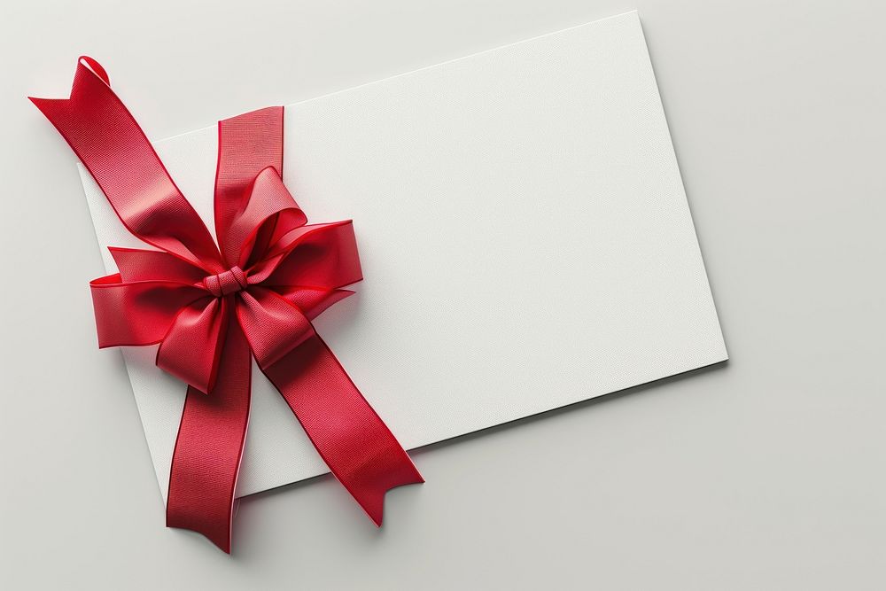 Gift card with red bow and ribbon wrapping on left corner of card white background celebration anniversary.