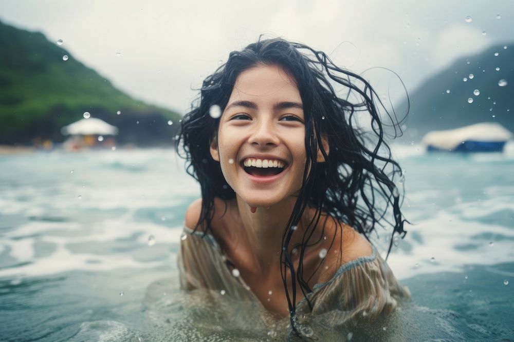 Happy hong konger woman swimming laughing portrait.