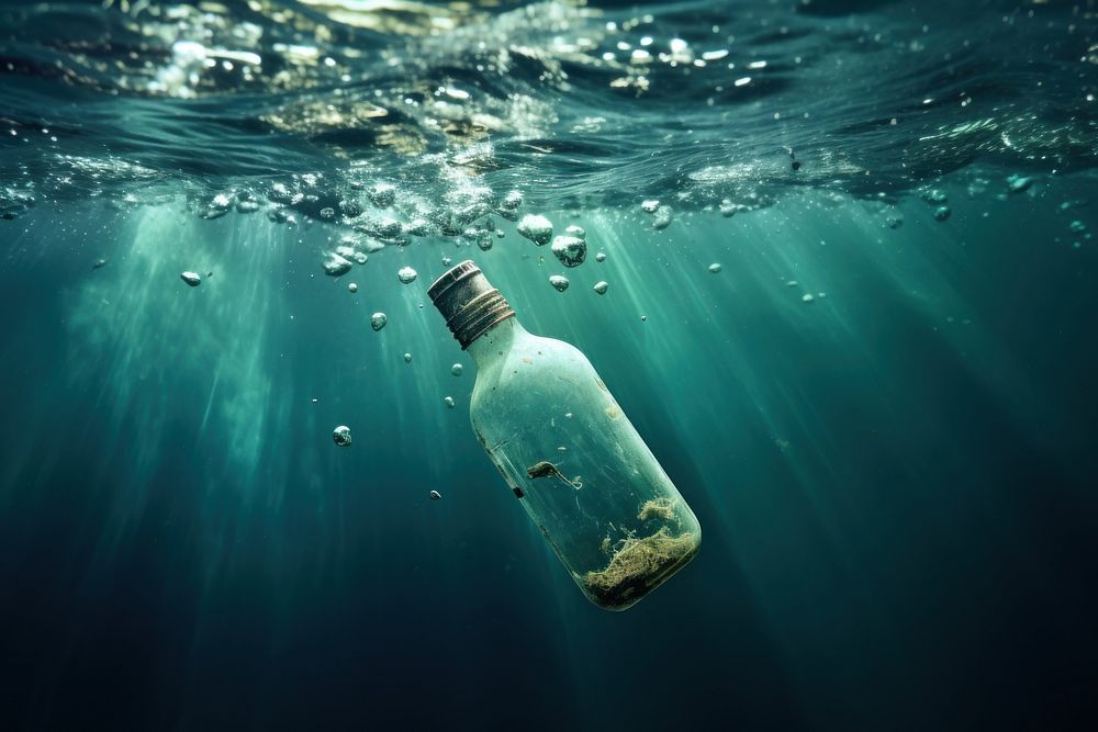 Glass bottle drop sea underwater Premium Photo rawpixel