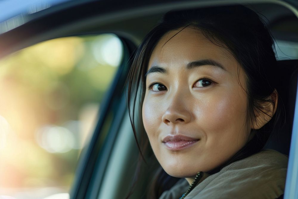 Asian woman driving a car happy vehicle window adult.