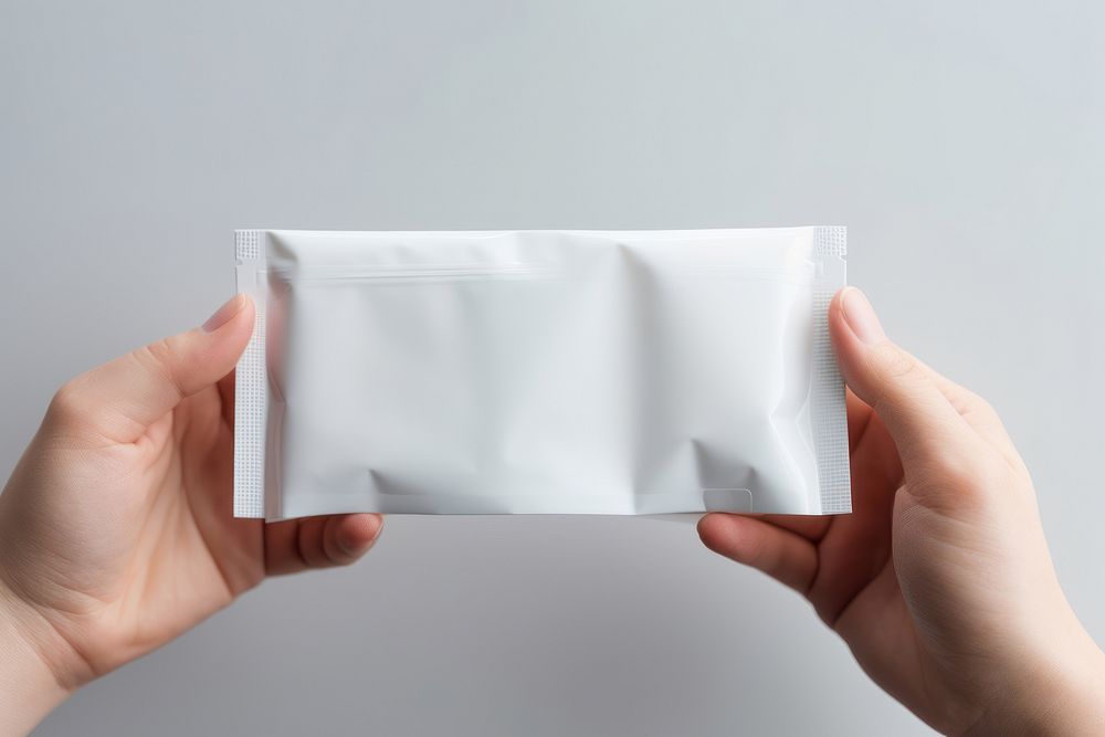 Doypack Packaging  holding white paper.