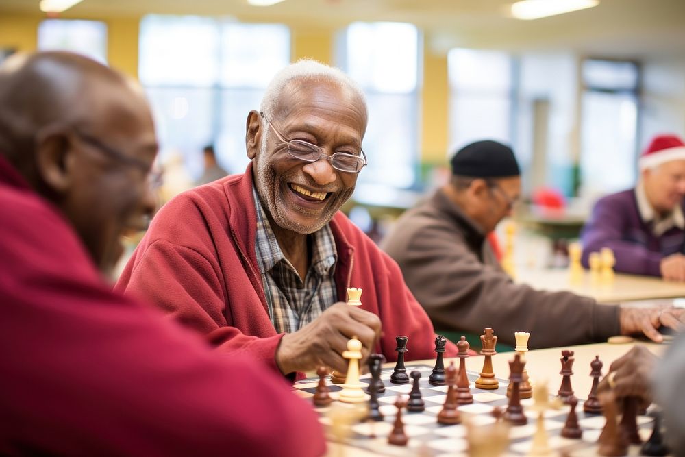 Group of seniors engaged in a lively game of chess at a community center adult men intelligence. AI generated Image by…