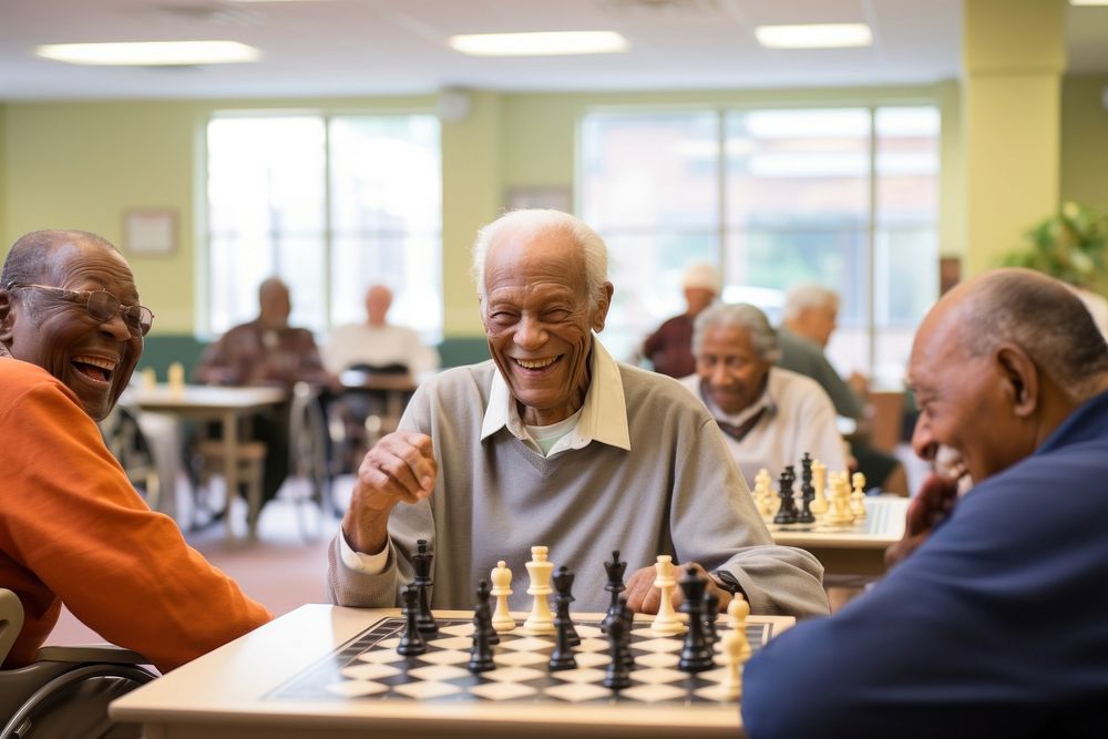 Group of seniors engaged in a lively game of chess at a community center adult men togetherness. AI generated Image by…