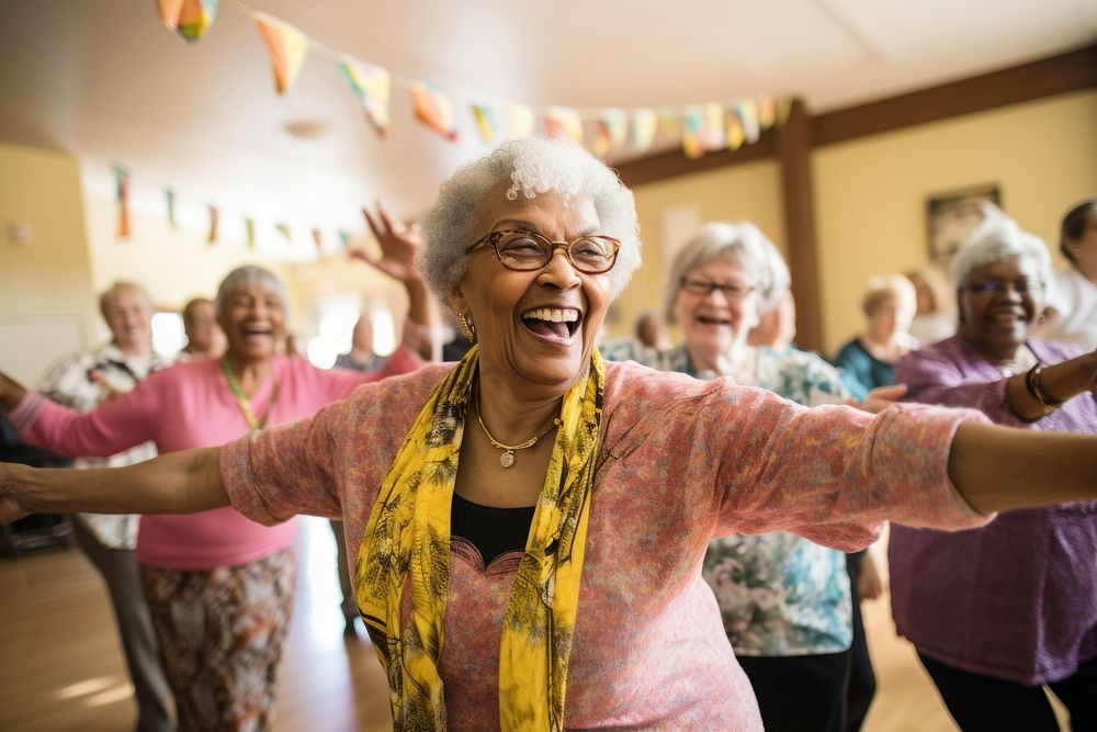 Group of seniors engaged in a lively dance session at a community center dancing laughing adult. 