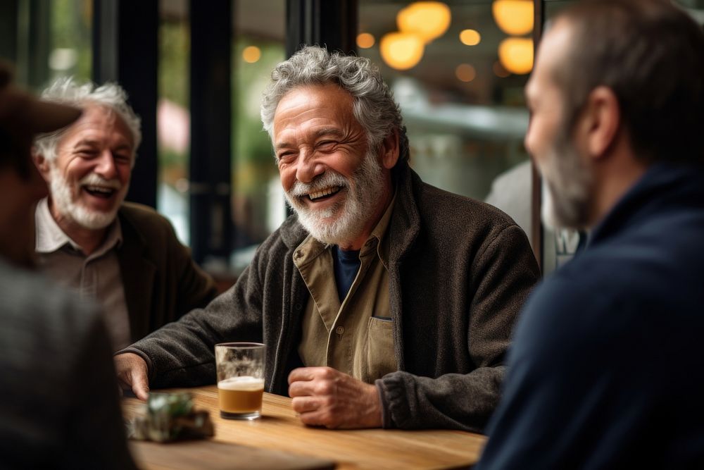 Senior gentleman engaged in a lively conversation with friends at a local cafe laughing adult togetherness. AI generated…