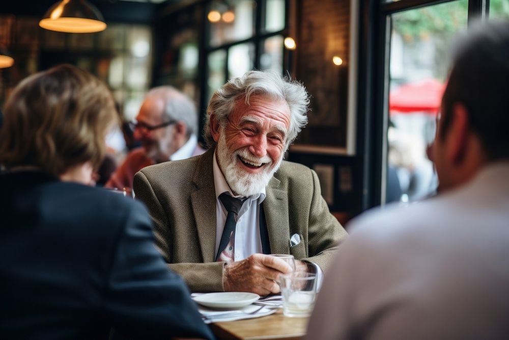 Senior gentleman engaged in a lively conversation with friends at a local cafe laughing adult mug. AI generated Image by…
