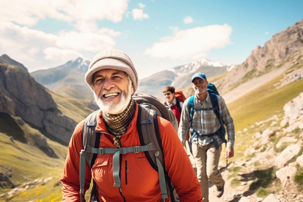Senior hiking group trekking through picturesque mountains recreation adventure backpack. AI generated Image by rawpixel.