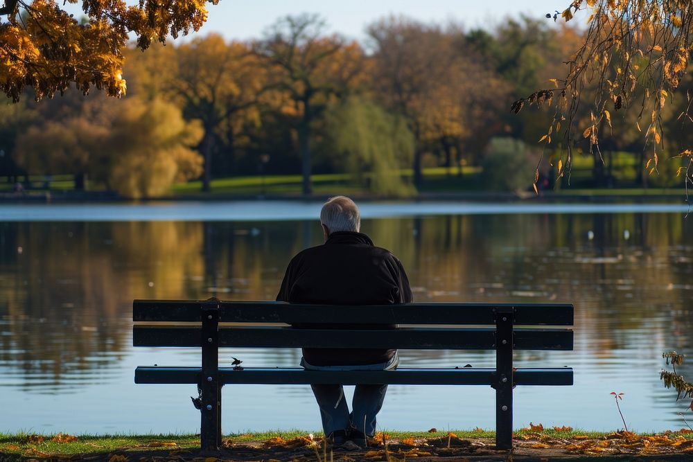 Elderly gentleman sitting on a park bench contemplation reflection solitude. AI generated Image by rawpixel.