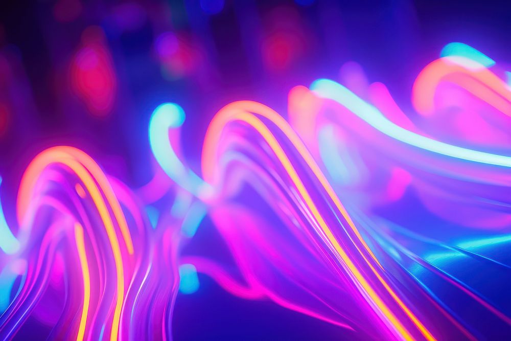 Blurred neon sparks light backgrounds purple.