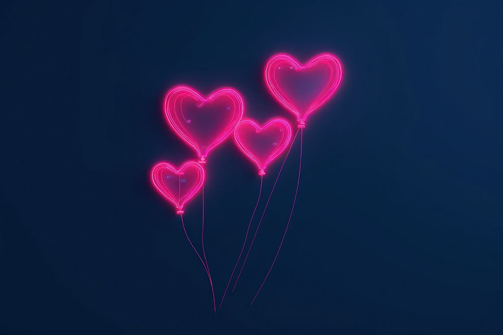 Heart balloons outdoors night illuminated.