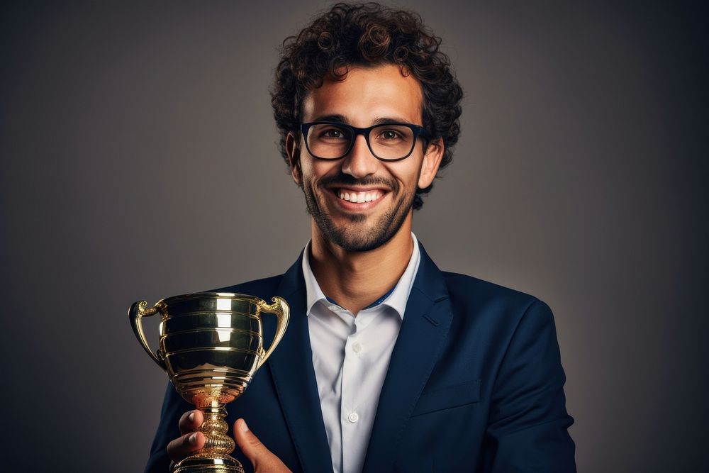 Happy businessman holding trophy portrait adult smile. AI generated Image by rawpixel.