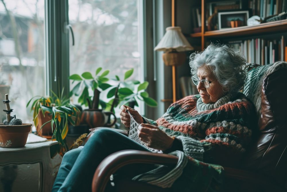Latina elder woman knitting on cozy chair adult architecture living room. AI generated Image by rawpixel.