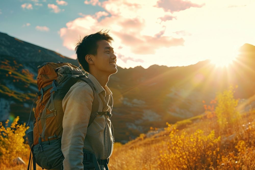 Asian man hiking adventure outdoors backpack.