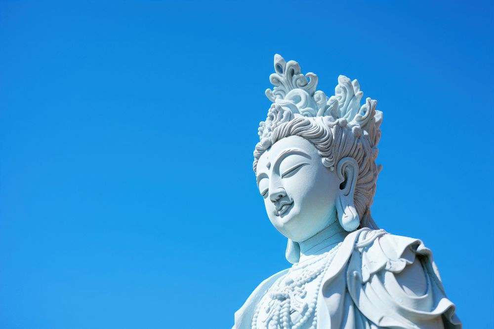 Guan yin statue blue sky representation. AI generated Image by rawpixel.