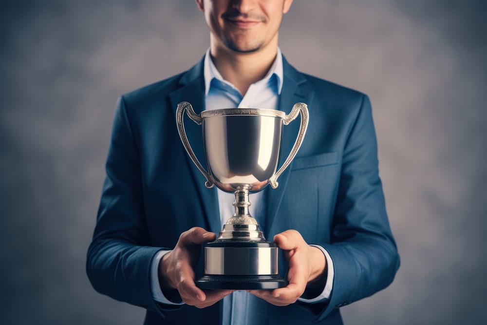 Happy businessman holding trophy achievement copy space midsection. AI generated Image by rawpixel.