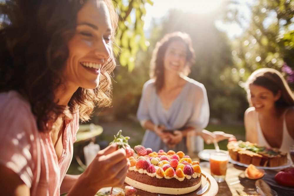 Woman eating cake party laughing dessert.