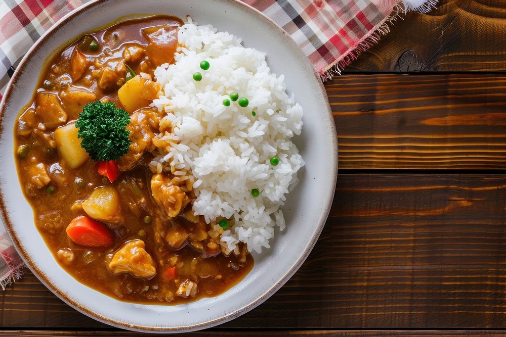 A dish of japanese curry rice on a clean table plate food meal. 