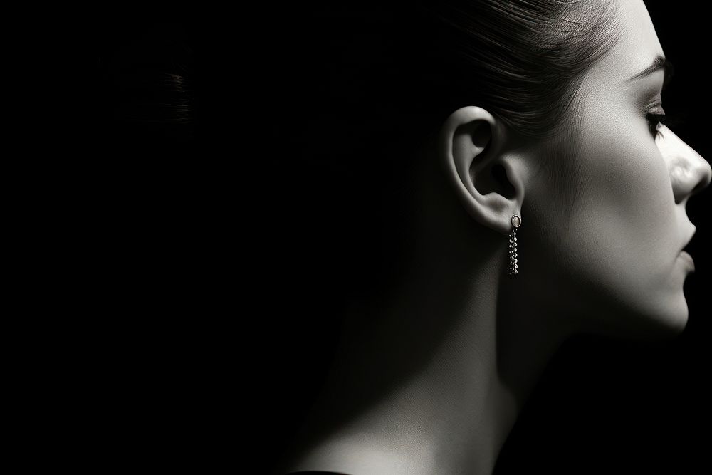 Ear wearing multiple earrings photography portrait jewelry.