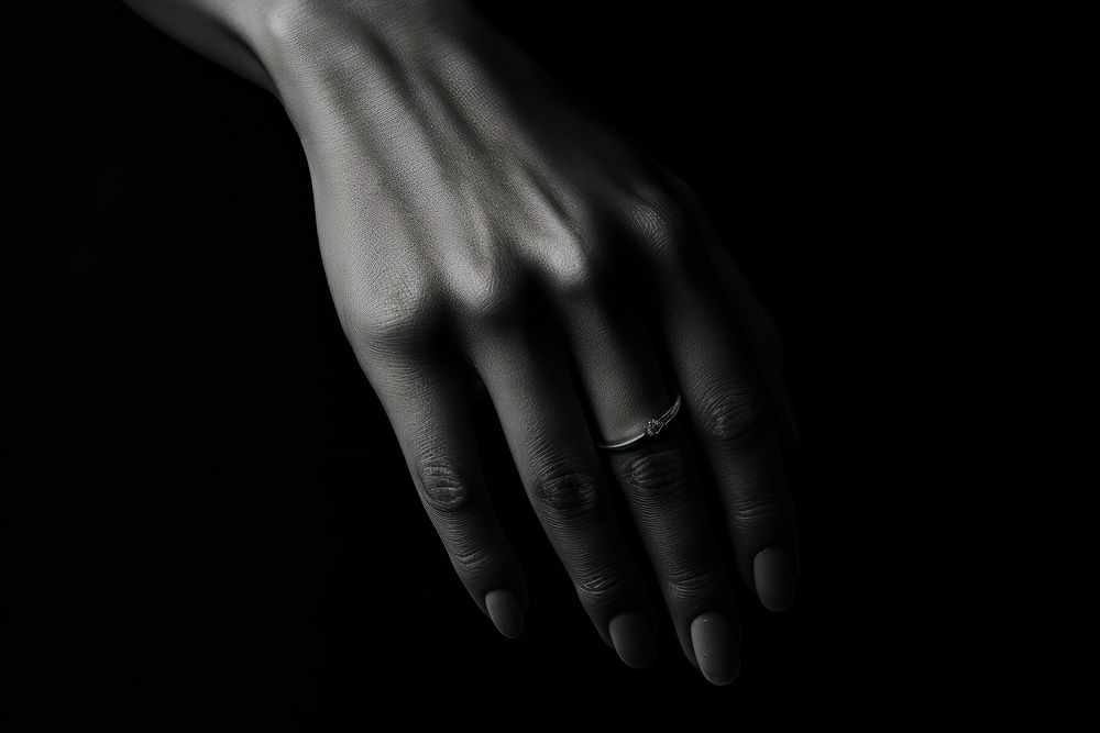 Hand wearing ring jewelry finger black.