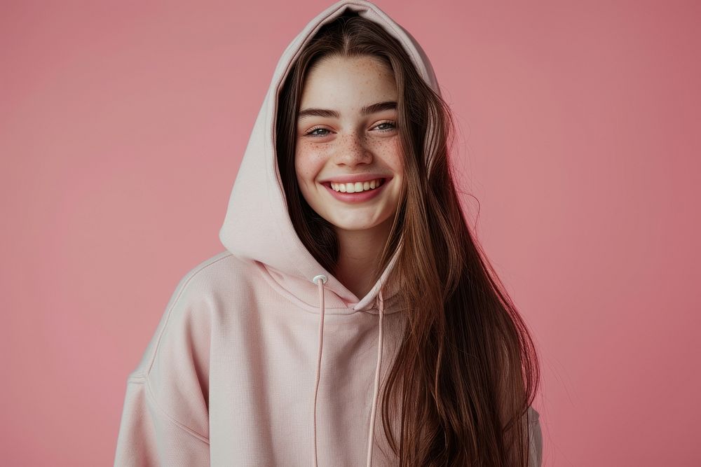 Young girl smiling wearing hoodies sweatshirt portrait laughing.