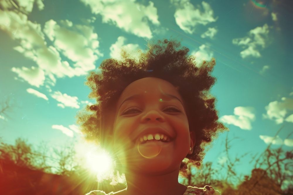 Little girl smiling outdoors photography sunlight.