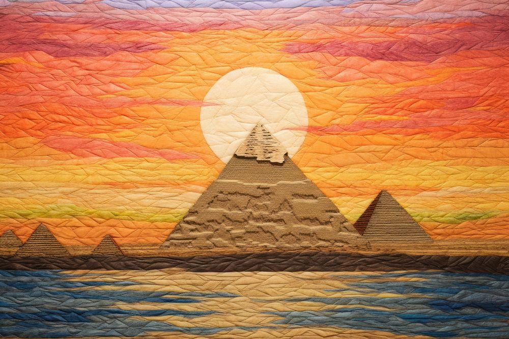Pyramid in desert on sunset architecture craft quilt.