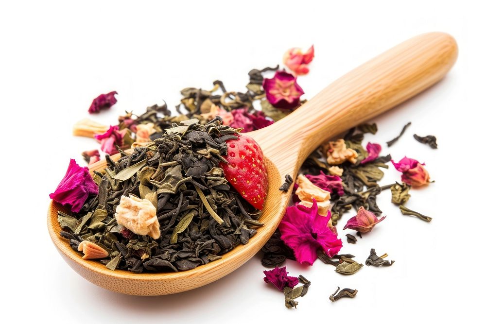 Mix of green tea with strawberry and hibiscus flowers plant herbs spoon.