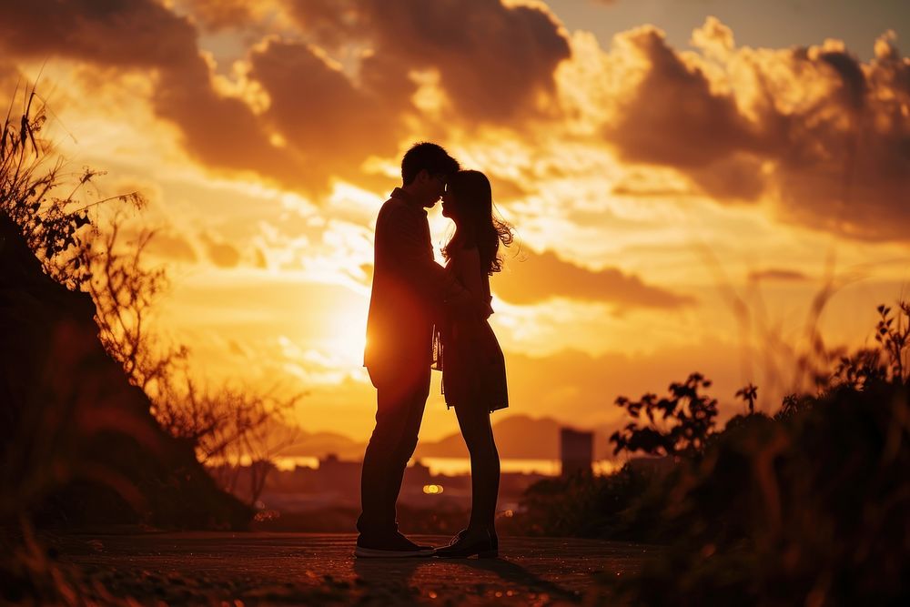 Taiwanese couple backlighting silhouette kissing. AI generated Image by rawpixel.