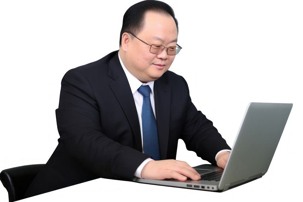 Chinese Businessman typing and replying email by a laptop furniture computer glasses. AI generated Image by rawpixel.