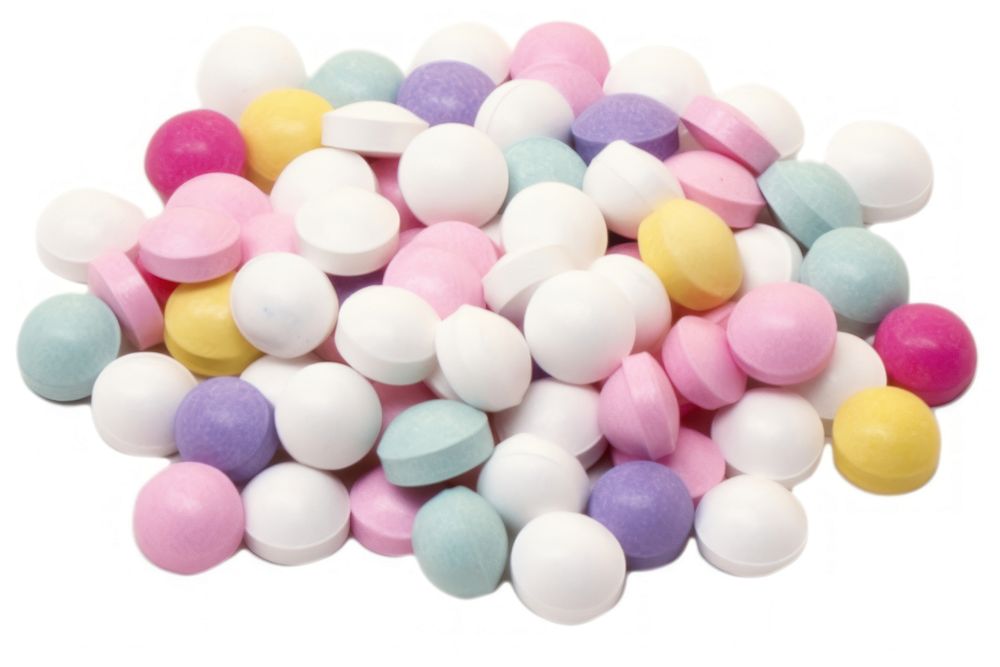 Multi-colored pills scattered on a bright background confectionery food white background. AI generated Image by rawpixel.