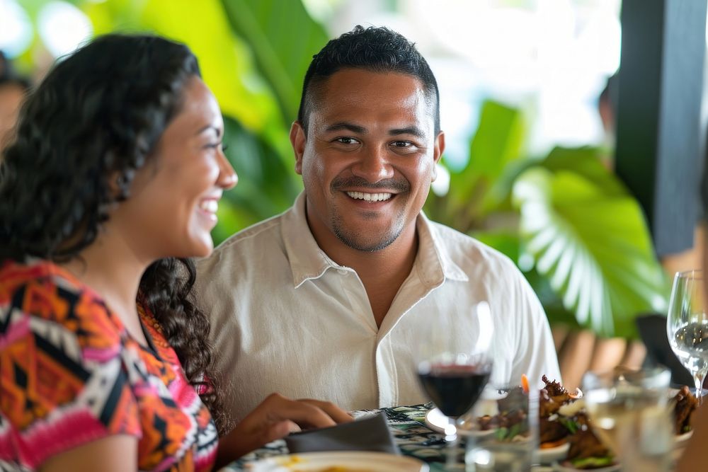 Samoan couple restaurant romantic dinner.
