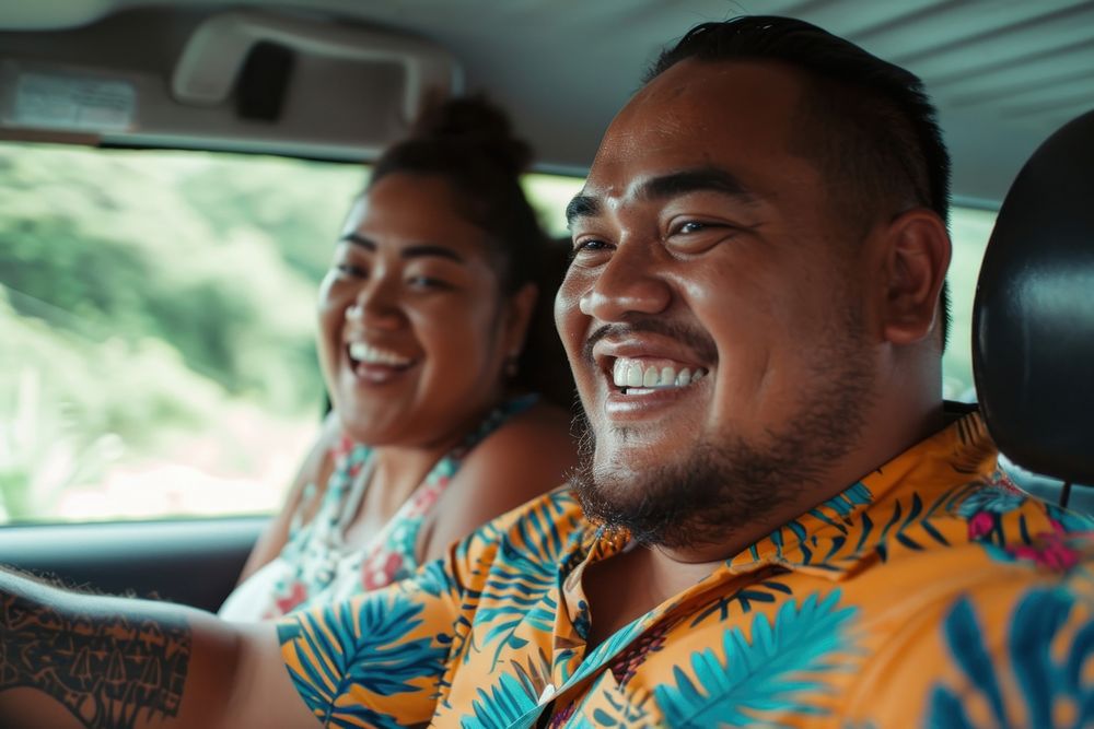 Samoan couple laughing portrait vehicle.