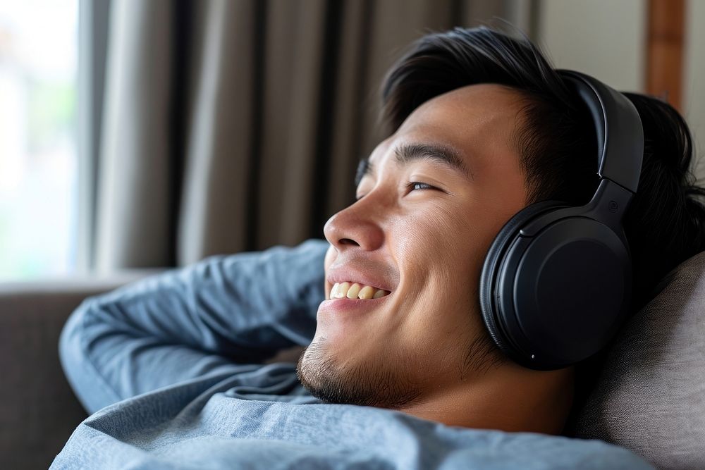Philipino man headphones headset happy.