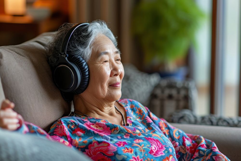 Senior asian woman headphones adult electronics.