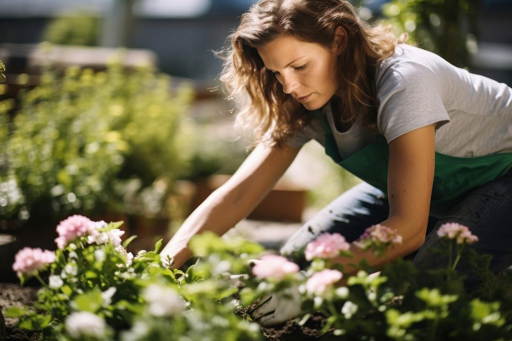 Woman gardener working gardening outdoors nature. AI generated Image by rawpixel.