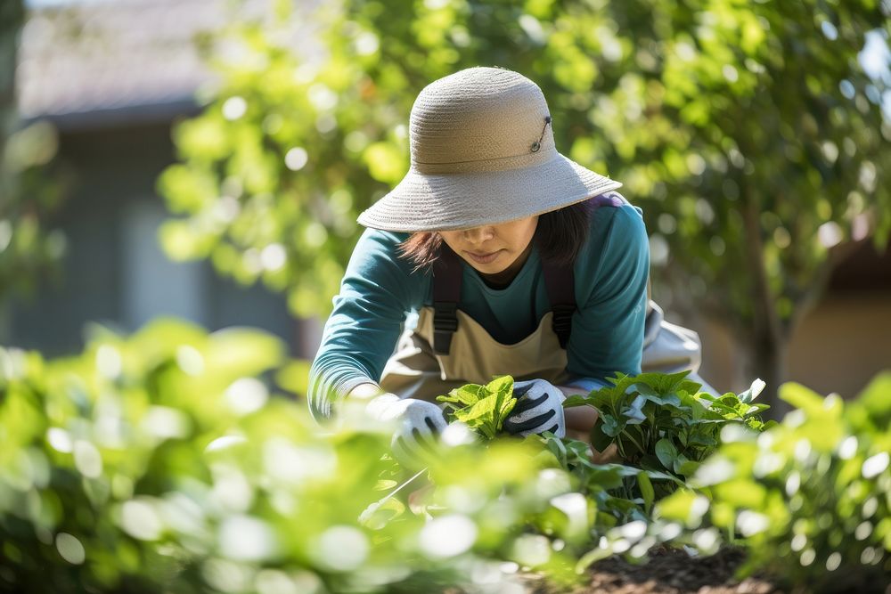 Mixed race asian gardener working gardening outdoors nature. AI generated Image by rawpixel.