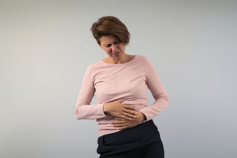 Mature woman with stomach pain sleeve adult anticipation. AI generated Image by rawpixel.