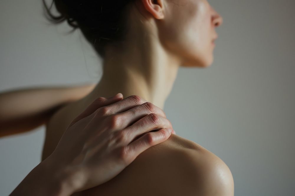 Hand touching on left shoulder adult back skin. AI generated Image by rawpixel.