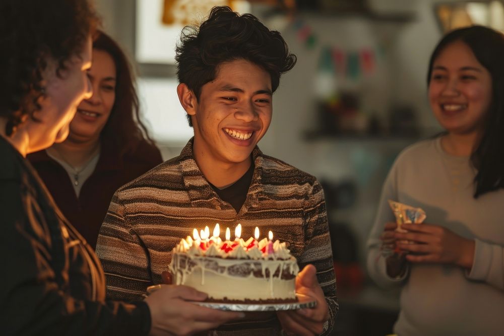 Latinx young-adult man party cake birthday.