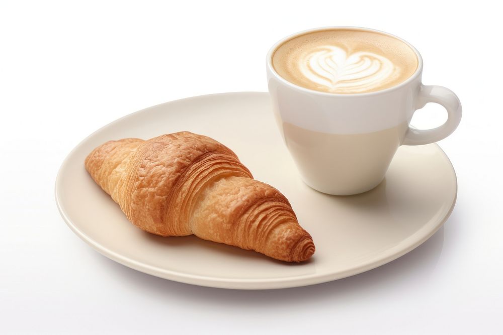 Cappuccino and croissant on same plate cappuccino breakfast coffee.