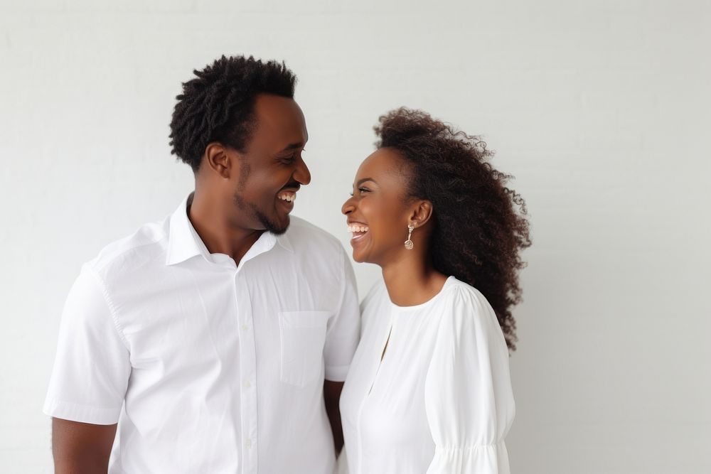 Ethiopian couple standing laughing smiling.