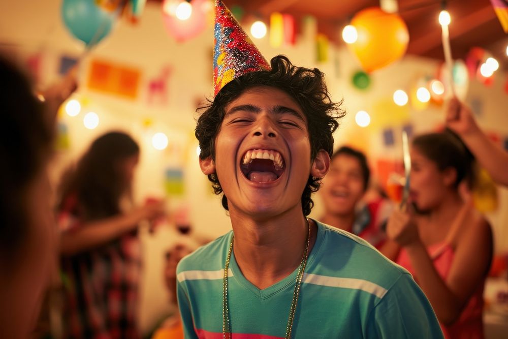 Hispanic teenager boy birthday laughing portrait.