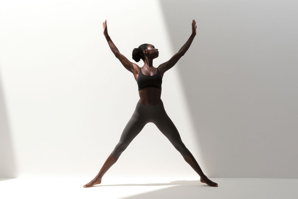 Black sports woman doing fly yoga stretching exercise dancing. AI generated Image by rawpixel.