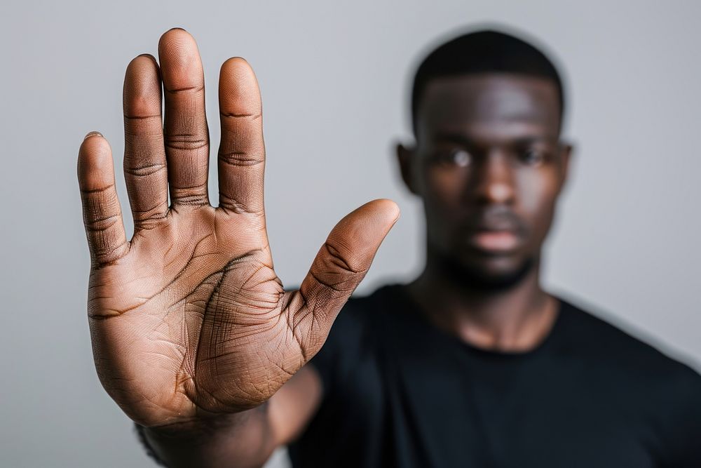 African American showing stop gesture hand finger adult.